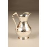 Victorian silver cream jug with engraved floral decoration. Assay marked London 1851 by Stephen