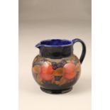Moorcroft pottery jug, pomegranate pattern, signed and inscribed to base, 14cm high
