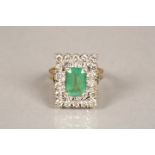 Ladies 18 carat gold diamond and emerald ring. Rectangular cut emerald surrounded by eighteen