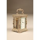 Silver cased carriage clock by Charles Frodsham London. White dial with Roman numerals, bevelled