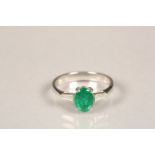 Ladies 18 carat white gold emerald and diamond ring, central emerald flanked by a baguette cut