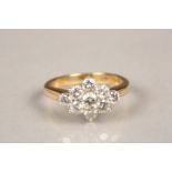 18 carat gold diamond cluster ring. Central 0.2 carat diamond surrounded by eight 0.08carat