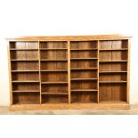 20th century oak open bookcase with adjustable shelving in four compartments. 310cm long 34cm wide