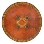 AN INDIAN LACQUERED HIDE SHIELD (DHAL), 19TH CENTURY of low convex form, the inside painted red