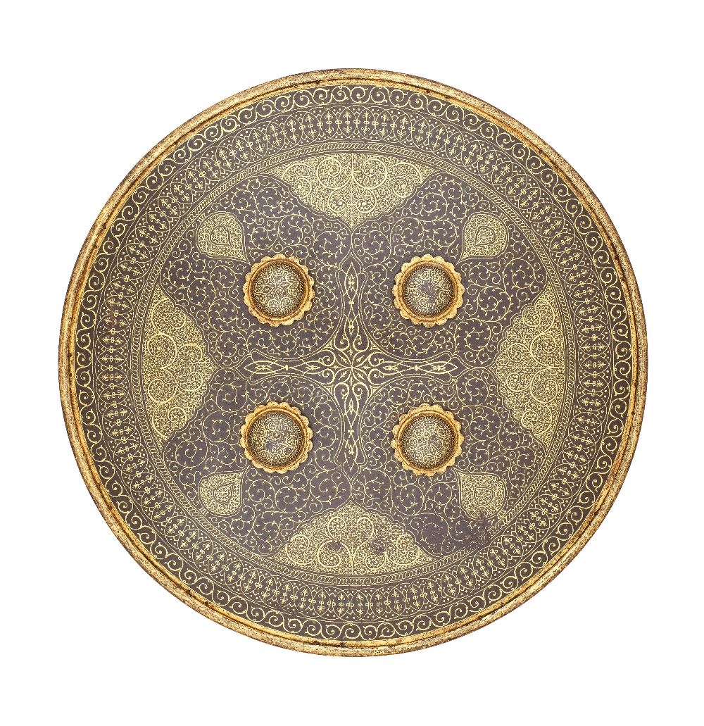 ‡ AN INDIAN SMALL SHIELD (DHAL), SECOND HALF OF THE 19TH CENTURY of shallow convex russet iron,