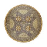 ‡ AN INDIAN SMALL SHIELD (DHAL), SECOND HALF OF THE 19TH CENTURY of shallow convex russet iron,
