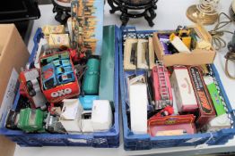 Two baskets containing quantity of boxed and unboxed die cast vehicles including a Dinky fire