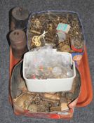 A tray containing two tins of clock parts, longcase clock weights,
