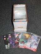 A box containing 21st century comics and graphic novels including Kick Ass, Captain America,