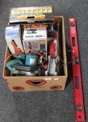 A box of assorted power tools, spirit level,