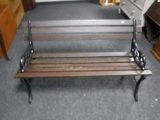 A cast iron and wood garden bench