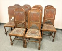 A set of ten late 19th century oak and tooled leather dining chairs.