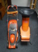 A Flymo electric lawn mower with box together with an Alco garden shredder