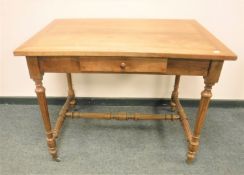 An antique style French side table fitted with a drawer,