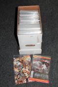 A box containing 21st century Marvel and DC comic including Deadpool, Green Arrow,