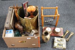 A box containing brass coal bucket, ship's style barometer and clock, wooden figures,