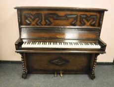 An early 20th century oak upright piano by James Smith & Son of Liverpool, width 146 cm.