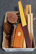 A box containing hand fans, carved Eastern hardwood wall shelf and table, book troughs,