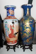 Two large Japanese vases on wooden stands