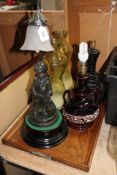 An inlaid oak twin handled serving tray together with a figural table lamp,