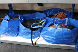 Four bags containing a large quantity of leather handbags