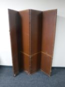 An early 20th century leather four way folding room divider