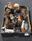 A box containing assorted china and resin animal figures,