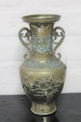 A 20th century brass Chinese twin handled embossed vase,