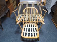An Ercol elm two seater settee and armchair,