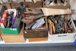 Four boxes and a crate of assorted hand tools, saws, paintbrushes,