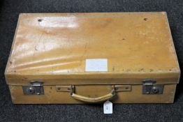 A vintage pig skin leather suitcase