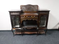 A Victorian mahogany chiffonier with a fret work panel
