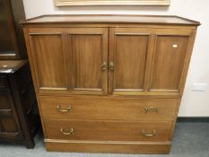 A late Victorian ecclesiastical cabinet fitted with two drawers, width 123 cm.