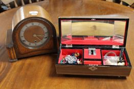 A jewellery box of costume jewellery together with an oak cased mantel clock