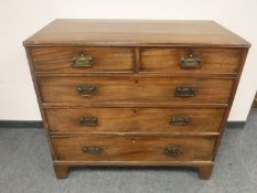 An early Victorian mahogany chest of five drawers on bracket feet,
