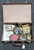 A vintage leather case containing a large collection of assorted lady's and gents wristwatches,
