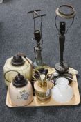 A tray containing two vintage glass pendant light fittings together with a china table lamp in the