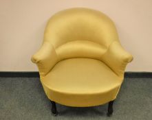 A Victorian lady's chair upholstered in golden fabric, width 76 cm.
