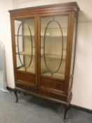 An Edwardian inlaid mahogany display cabinet,