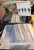 Two boxes of LP records, mainly pop and rock, including The Beatles, The Who, Primus,
