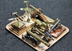 A tray of metal cannons, brass aircraft,