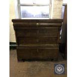 An antique continental oak four drawer chest