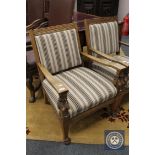 An early 20th century carved oak armchair CONDITION REPORT: In good condition with