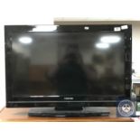 A Toshiba 32 inch LCD TV with remote