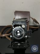 A Zeiss Ikon folding camera in case