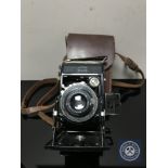 A Zeiss Ikon folding camera in case