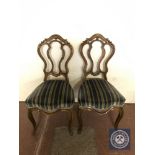 A pair of French walnut dining chairs in striped fabric