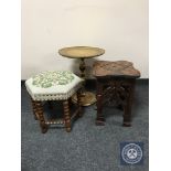 A carved plant stand together with a gilt wine table and hexagonal footstool