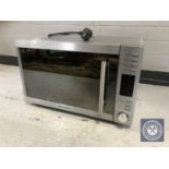 A stainless steel Russell Hobbs microwave with grill