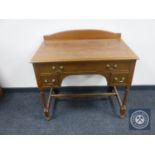 An Edwardian dressing table fitted with three drawers